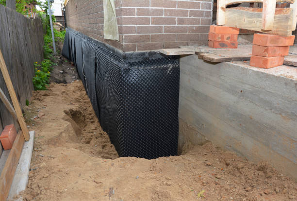 SJ Waterproofing Pros technician performing targeted Exterior Waterproofing assessment in Hamburg, MN